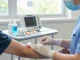 Patient receiving treatment with medical gauze in a healthcare setting, showcasing compassionate care and professionalism.